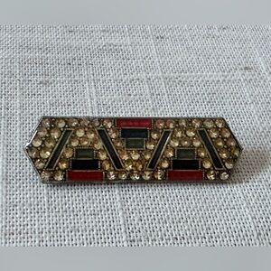 vintage Art Deco-style bar brooch, work of the French jewelry house Pierre Bex.